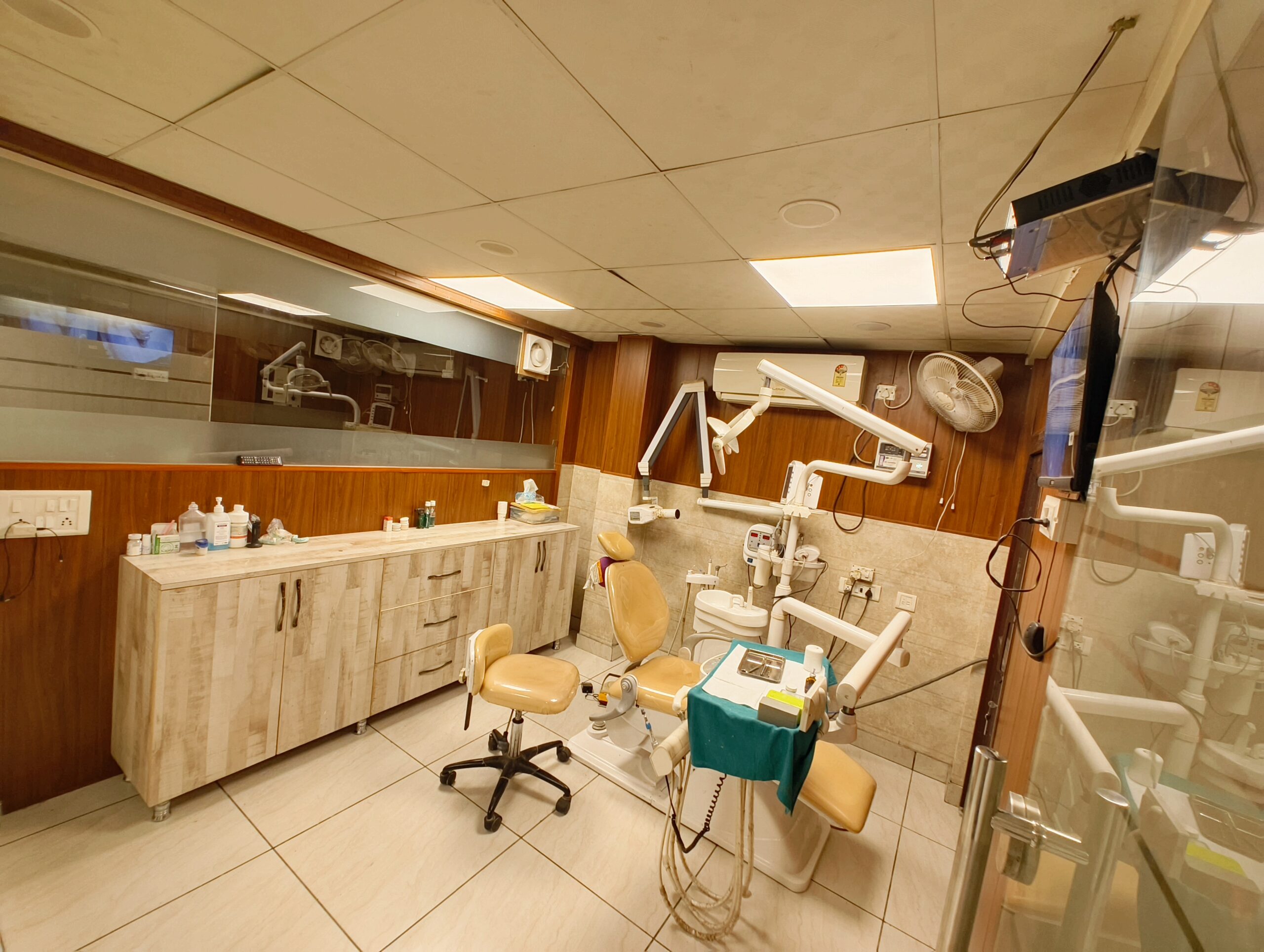 Dentist treating a patient at Gupta Dental Clinic